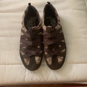 Coach Brown slip on sneakers.